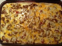 a casserole dish with sausage and cheese