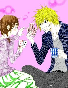 two anime characters sitting next to each other with playing cards in front of their faces