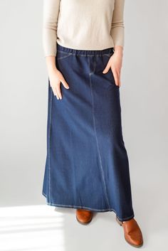 With the look of real denim but the feel of soft knit, comfort is the key element in our Caroline skirt. The quick, effortless pull-on style makes this skirt an effortless option for every day. Larger waist-size? The elastic waistband gives stretch without feeling bulky. A skirt like this will take you through the day, from grocery shopping to making dinner, or even a quick coffee shop visit for a chat with a friend over lattes! This skirt has become a best-seller. Style: elastic waist, soft knit fabric, functioning back pockets Color: navy denim Fabric content: 65% Cotton, 30% Polyester, 5% Spandex Care instructions: wash gentle cycle, cold; lay flat to dry, cool iron if needed. Our sizing is always approximate and can also vary due to personal preference and body shape. Please allow a 1" Making Dinner, Quick Coffee, Be Intentional, Knit Maxi Skirt, Modest Clothing, Long Knit, Curated Gifts, Grocery Shopping, Body Shape