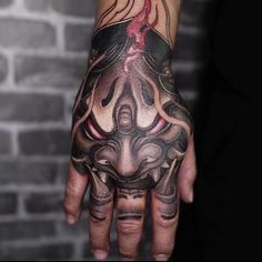 a person with a tattoo on their hand