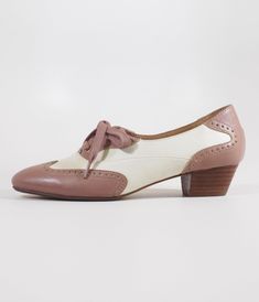 These delightful 1950s saddle shoes from Chelsea Crew blend classic elegance with a playful spirit, featuring a stylish mauve and bone color scheme that’s perfect for any outfit. The chic perforation detail adds a touch of whimsy, while the lace-up vamp ensures you’ll stay comfy all day long. Complete with a 1 inch heel.This is a Special Order item, please allow a 2-3 day handling time.Sizing runs small, if you're in between sizes, size up.Available while supplies last. Saddle Shoes, Bone Color, Mary Jane Pumps, Classic Elegance, The Chic, Color Scheme, Unique Vintage, Saddle, 1 Inch