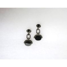 This is part of Chairish’s Fine Jewelry assortment.  A beautiful pair of black onyx and sterling silver Art Deco style dangle earrings, circa mid to late-20th century. A great pair to dress up or down. Each are marked on back 'Sterling' as shown in last three images. Excellent condition as shown in images. No issues. Dimensions: 1.5" Long. Elegant Black Enamel Round Earrings, Luxury Onyx Drop Earrings, Elegant Round Earrings With Black Diamonds, Luxury Black Earrings With Polished Finish, Modern Pierced Chandelier Earrings For Formal Occasions, Modern Pierced Chandelier Earrings For Formal Events, Luxury Black Round Clip-on Earrings, Black Enamel Onyx Drop Earrings, Onyx Drop Earrings With Black Enamel