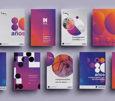 an assortment of brochures designed to look like abstract shapes and colors are shown