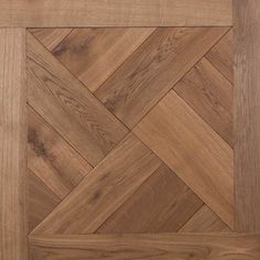 an image of wood flooring that looks like herringbones in the shape of a square