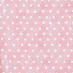 a pink background with white polka dots