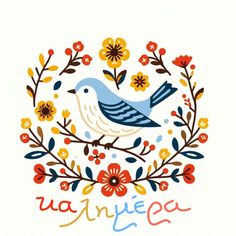 a blue bird sitting on top of a flower filled wreath with words written in spanish