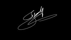 an autographed photograph of a person's handwritten signature on a black background