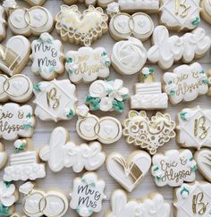 many decorated cookies are arranged on a table