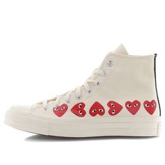 The iconic Chuck Taylor silhouette gets a luxurious upgrade with the Comme des Garcons Play x Chuck 70 Hi Top Multi Heart. This high top sneaker features a premium canvas upper in an off white hue, with shiny metal eyelets, double stitching, and Comme des Garcons heart icons on the sidewall for a signature touch. A vulcanized rubber midsole and rubber outsole complete the vintage look and feel of this must-have sneaker. Chuck Taylor Outfit, Heart Converse, Cdg Converse, Converse Play, Converse Comme Des Garcons, Play Converse, Garcons Converse, Comme Des Garcons Converse, Comme Des Garcons Play