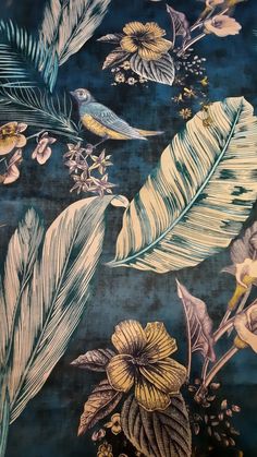 a blue and yellow floral wallpaper with birds, flowers, and leaves on it