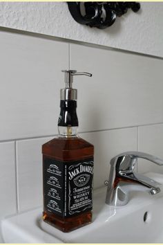 a soap dispenser sitting on top of a bathroom sink