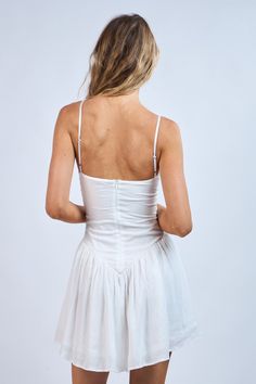 The Ainsley White Smocked Cami Mini Dress is the outfit that you have been looking for your whole life! White fabric shapes this cami strap mini dress with a smocked drop waist, a square neckline, and a high-low hem. Features adjustable straps and a hidden back zipper. Style with your favorite sandals for a cute and casual look! DETAILS & FIT Stretchy Fitted Waist. Hits at Upper Thigh. 70% Rayon, 30% Polyester. Lining: 100% Polyester. Dry Clean for Best Results. Imported. Summer Sundress With Spaghetti Straps And Fitted Bodice, Spring Mini Dress With Smocked Back And Sweetheart Neckline, Sundress With Spaghetti Straps And Fitted Bodice For Brunch, Sundress With Fitted Bodice And Spaghetti Straps For Brunch, Fitted Bodice Sundress With Spaghetti Straps For Brunch, Summer Smocked Cotton Dress With Adjustable Straps, Cotton Smocked Dress With Spaghetti Straps For Vacation, Ruffled Straps Sundress With Adjustable Straps, Spring Mini Dress With Smocked Bodice And Square Neck