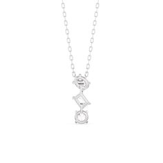 This diamond trilogy necklace embraces modern elegance with its minimalist aesthetic. It features a vertical row of oval, pear, and round diamonds, each weighing 0.25 carats. Designed with no distracting embellishments, this necklace's pure beauty shines. Modern Diamond Necklace For Anniversary, Modern Diamond White Diamond Necklace, Modern Solitaire Necklace For Formal Occasions, Modern Diamond Solitaire Necklace, Modern Diamond Pendant Necklace, Modern Silver Diamond Necklace, Modern Oval Diamond Necklace, Modern Teardrop Pendant Necklace For Anniversary, Elegant Diamond White Three Stone Necklace