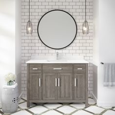 a bathroom with a white brick wall and a round mirror on the wall above it