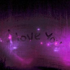 the word love is written in purple light