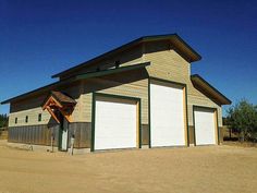 two garages in the middle of an empty lot