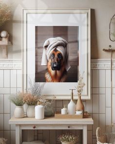 a dog with a towel on it's head sitting in front of a table