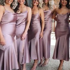 the bridesmaids are all wearing different styles of dresses