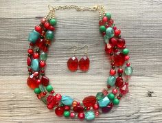 Great jewelry for the holiday season! Various shades of red and green acrylic beads in our signature confetti style :) Necklace is approximately 16 inches long plus a 4 inch extender chain.  Earrings are a single bead on a fishhook as shown.  I make these in ANY and ALL color combinations for your child's teams, college, pro team, sorority, place of work, or just any of your favorites! These make great, affordable bridesmaid necklaces for weddings as well. Just message me with your wedding colors and I will make you a sample.  *Smoke and pet free home!* I ship 6 days a week! Thank you for browsing my store! Bridesmaid Necklaces, Holiday Necklace, Gold Holiday, Single Bead, Jewelry Beaded, Green Jewelry, Bridesmaid Necklace, Christmas Jewelry, Style Necklace