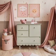 a baby's room decorated in pink and white