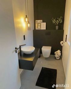 a modern bathroom with black and white decor