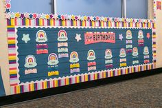 a wall decorated with rainbows and stars