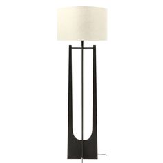 a floor lamp with a white shade on the base and a black metal frame around it