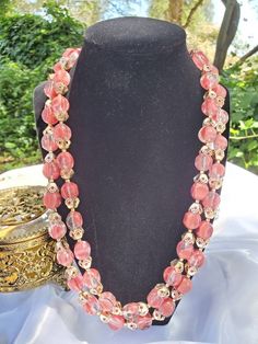 This is such a pretty pinkish double stranded beaded necklace. I don't see any damage, just normal aged patina around clasp. Approx 10 inches long fully clasped. Signed Hong Kong https://www.etsy.com/shop/VintageByTerri Please remember that these items are previously loved items...which is part of their charm. They all have their own story to tell. I try to describe any flaws I see but I also am not perfect, so please look at the photos carefully. I do NOT clean my Jewelry items as I am afraid t Pink Multi-strand Large Beads, Costume Jewelry Double Strand Beaded Necklaces, Double Strand Beaded Costume Necklaces, Vintage Multi-strand Necklace With Faceted Beads, Vintage Multi-strand Necklaces With Polished Beads, Pink Multi-strand Jewelry With Polished Beads, Formal Multi-strand Beaded Costume Jewelry Necklace, Vintage Pink Single Strand Jewelry, Vintage Pink Faceted Bead Jewelry