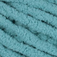 blue yarn is shown in close up