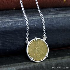 This Italian 20 Lire rests in a handcrafted setting made of recycled sterling silver wire. I make each setting by hand separately from the coin. The coin does not have a hole drilled in it or any metal soldered to its edge. The setting is attached to a sterling silver link chain. Excluding the year on the coin, your coin pendant will look like the pendant pictured. Each coin pendant is made by hand (not a machine), and no two coins are exactly alike. The years that I have in stock are listed. If Nickel-free Sterling Silver Coin Necklace As Gift, Nickel Free Sterling Silver Coin Necklace Gift, Nickel-free Sterling Silver Coin Necklace For Gift, Adjustable Sterling Silver Coin Necklace Gift, Handmade Coin Jewelry For Anniversary, Sterling Silver Hallmarked Coin Necklace Gift, Anniversary Sterling Silver Coin Necklace, Handmade Sterling Silver Coin Pendant Necklace, Handmade Coin-shaped Artisan Jewelry