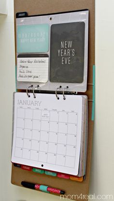 a desk calendar is attached to a bulletin board