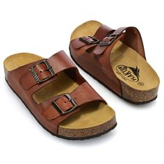 We're sure the Beta sandals from Plakton are going to become a fast favorite in your footwear collection! With their classically appealing design made of vaqatilla leather, they are an understated addition to any outfit. Their design also features an easy slide-on style, a slightly firmer outsole, a cushioned footbed and two adjustable buckles. Get that perfect fit and let the contoured shape of this comfortable sandal help you walk anywhere in style! Brown Flat Heel Slippers With Cork-bed Midsoles, Brown Sandals With Leather Footbed And Round Toe, Brown Leather Footbed Sandals With Round Toe, Brown Round Toe Sandals With Leather Footbed, Brown Closed Toe Sandals With Leather Footbed, Brown Synthetic Sandals With Cushioned Footbed, Brown Leather Footbed Slippers For Vacation, Brown Slip-on Slippers With Buckle Closure, Brown Slippers With Buckle Closure And Round Toe