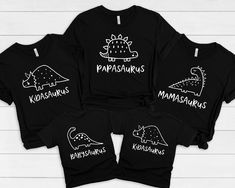 three t - shirts with dinosaurs on them and the words'kapschumus '