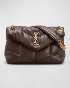 "Find SAINT LAURENT Lou Puffer Small Ysl Shoulder Bag In Quilted Leather on Editorialist. Saint Laurent \"LouLou\" shoulder bag crafted in matelassé quilted leather. The bag features a sliding leather and metal chain shoulder strap that can be doubled, with a drop of 11\" to 20\". The flap top is secured with a snap closure and showcases the iconic YSL monogram in metal. It features golden hardware and has a spacious interior with one main compartment and one zip pocket. The bag is lined in gros Designer Brown Quilted Bag, Designer Quilted Brown Bag, Brown Quilted Leather Shoulder Bag, Brown Quilted Leather Bag, Designer Quilted Shoulder Bag For Travel, Luxury Quilted Shoulder Bag For Travel, Elegant Brown Quilted Shoulder Bag, Elegant Brown Quilted Bag, Quilted Brown Evening Bag