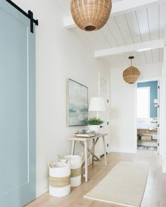 a living room filled with furniture and white walls