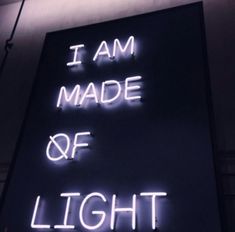 a neon sign that says i am made of light