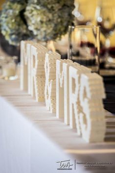 the table is set with place cards for guests to write their names and numbers on them