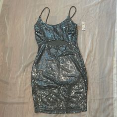 Beautiful Silver Dress Size Medium. New Spring Silver Shimmer Mini Dress, Gray Mini Party Dress, Spring Silver Sequin Dress With Shimmer, Silver Shimmer Summer Dress, Spring Metallic Silver Sequin Dress, Shiny Silver Summer Dresses, Silver Summer Dress For Date Night, Glamorous Gray Dress For Night Out, Silver Mini Length Holiday Dress