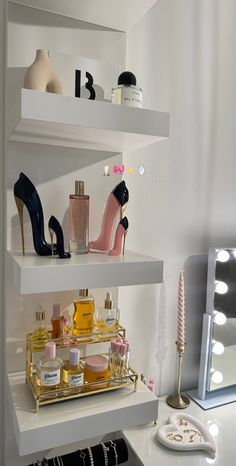 the shelves are filled with different types of cosmetics and perfume bottles on top of each other