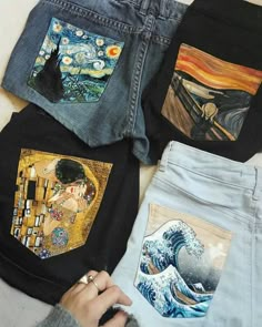 four different colored jeans with pictures on them