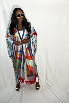 Rich Auntie at it's finest! Our fashion satin kimono can be worn as an oversized dress on it's own or cinched at the waist for a more fitted look. Flowy and colorful style definitely can make this a beach coverup or vacation look. In One Size fits most as the sleeves are open flowy and the kimonos have an open front. Size US Size One Size Open Front Robe For Spring Party, Spring Party Robe With Open Front, Spring Open Front Party Robe, Spring Satin Kimono For Loungewear, Chic Multicolor Silk Kimono, Multicolor Silk Kimono For Fall, Multicolor Silk Robe For Spring, Spring Party Satin Kimono, Long Satin Summer Robe