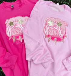 School mascot team sweatshirt, preppy pink mascot patch sweatshirt, preppy game day sweatshirt, game day sweatshirt, chenille patch, team gifts Hot Pink and Light Pink sweatshirts really make these Pink Preppy Mascots POP! - This listing is for a sweatshirt with the Preppy Mascot Patch Only, no lettering. ✨Youth Sizes are SAFETY PINK DETAILS : ✨Sweatshirts• Our 2 main color options are Heliconia (Hot Pink) in the Gildan Brand and Light Pink in the Jerzee brand. • see color chart for options• siz Pink School Spirit Sweatshirt, Pink Crew Neck Top For School Spirit, Pink Casual School Sweatshirt, Pink Embroidered College Sweatshirt, Pink Smiley Face Sweatshirt, Cheerleading Team Gifts, Pink Sweatshirts, Sweatshirt Preppy, Game Day Sweatshirt