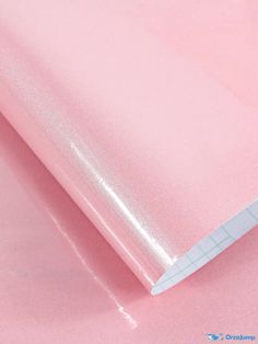 a close up view of a pink background with some white lines on the bottom and top