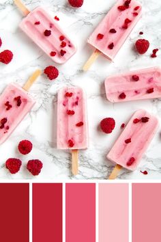 popsicles with raspberries on them and pink hues