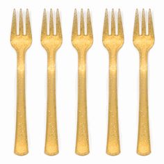 five forks with gold glitter on them are lined up in a row against a white background