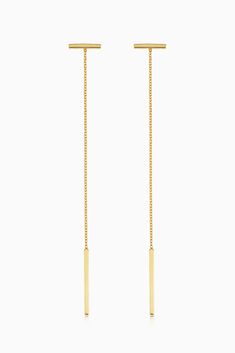 A long vertical line dropping from a short horizontal bar, creates the stunning linear visual that is our Tea Time Drop Earrings. Sure to be a quick favorite, they are light and easy to wear, at tea time, a night out and pretty much everywhere in between. Metal: 14k Yellow Gold Weight: 1.2 Grams Crafted in San Zeno, Vicenza, Italy Minimalist Long Drop Threader Earrings For Formal Events, Minimalist Long Drop Threader Earrings For Formal Occasions, Minimalist Long Drop Linear Earrings With Adjustable Chain, Minimalist Linear Drop Earrings With Adjustable Chain, Formal Linear Earrings With Delicate Chain And Long Drop, Minimalist Linear Earrings With Adjustable Chain, Yellow Gold Long Drop Linear Earrings For Everyday, Everyday Yellow Gold Long Drop Linear Earrings, Formal Long Drop Earrings With Delicate Chain