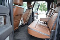 the interior of a vehicle with tan leather seats