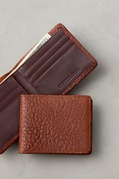 Exuding the untamed attitude of the American West, the Billings leather bifold wallet carries a lot in a small space. The Billings wallet is crafted to hold multiple credit cards and cash,  plus its unique pebbled finish adds to its authenticity. Travel Textured Leather Bifold Wallet, Brown Textured Leather Bifold Wallet, Casual Bifold Wallets With Coin Pocket, Casual Bifold Wallet With Coin Pocket, Casual Bifold Leather Card Holder, Casual Leather Wallet As Gift, Casual Brown Bifold Wallets, Textured Leather Bifold Wallet For Daily Use, Brown Textured Leather Wallet For Daily Use