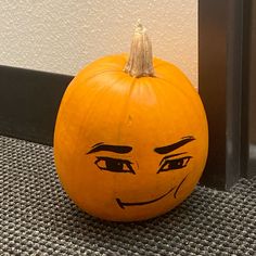 a pumpkin with a face drawn on it