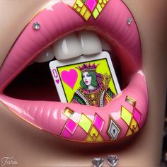 a woman's lips are decorated with pink lipstick and an image of a playing card